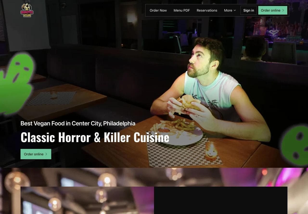 Monster Vegan homepage hero showing its horror-themed dining room, Philadelphia positioning, and direct order button.
